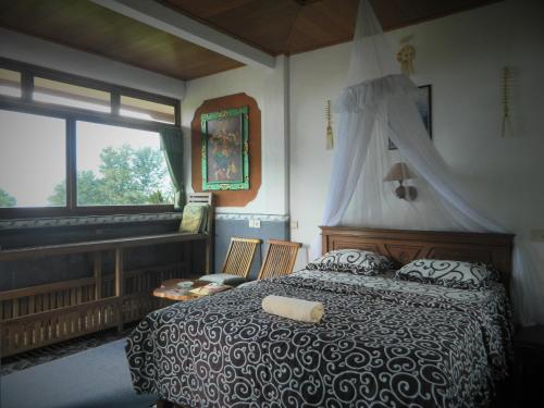 Ένα ή περισσότερα κρεβάτια σε δωμάτιο στο Dau Homestay