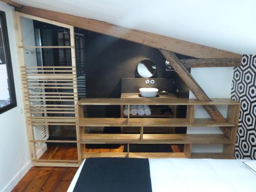 Кровать или кровати в номере L'appartement de Margot