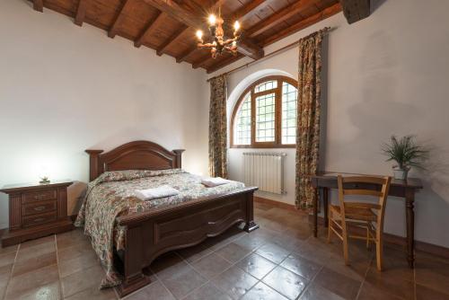 Postel nebo postele na pokoji v ubytování Agriturismo Casapasserini