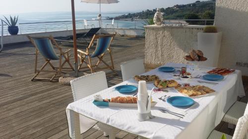 a table with food on top of a balcony at B&B alla Canale in Vasto
