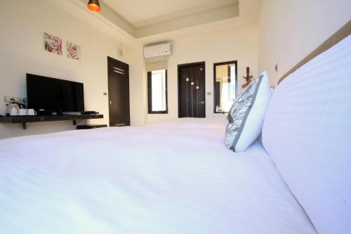 Una cama o camas en una habitación de Water Ripple