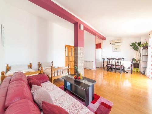 a living room with a couch and a table at Apartments Midžor in Petrovac na Moru