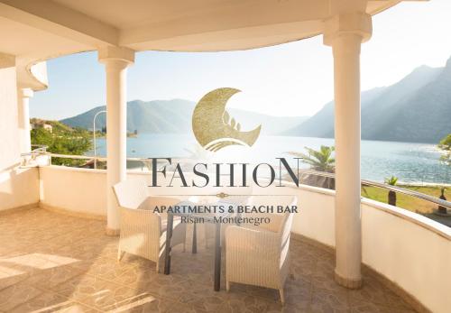 a balcony with a sign for a beach bar at Fashion Beach Apartments in Risan