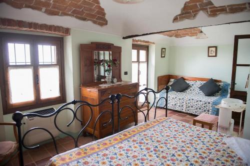 a bedroom with two beds and a bed sidx sidx sidx sidx at B&B Ca' dla Nona in Brusasco