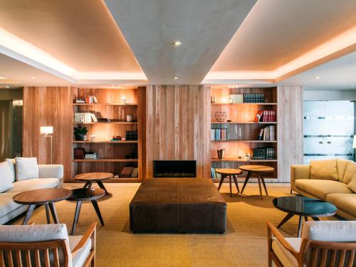 a living room with a couch and a table at Hotel Chiqui in Santander