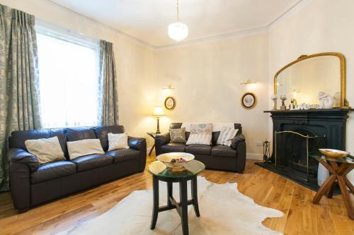 a living room with a couch and a fireplace at Dublin Vacation Rentals in Dublin