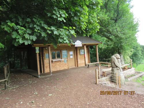 a small building with a statue in front of it at Apartment 20 Inchmarlo in Banchory