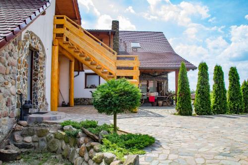 a house with a staircase on the side of it at Rancho Zapotoczny in Łagów