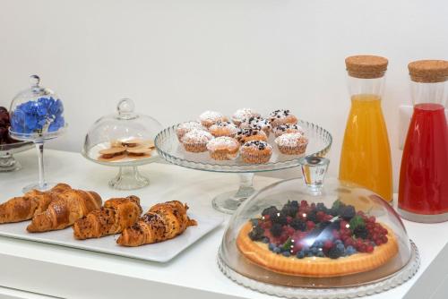 a table with three plates of pastries and other desserts at A un passo dal mare in Vieste