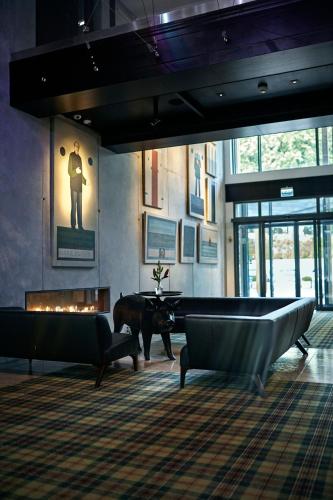 a large room with a pool table and a fireplace at Bristol Art & Medical SPA in Busko-Zdrój