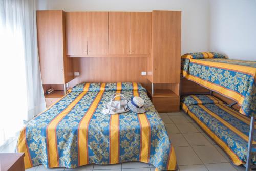 Postel nebo postele na pokoji v ubytování Pensione Villa Joli