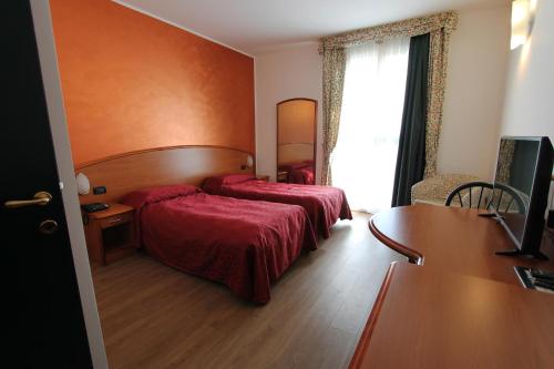 Postel nebo postele na pokoji v ubytování Hotel Europa