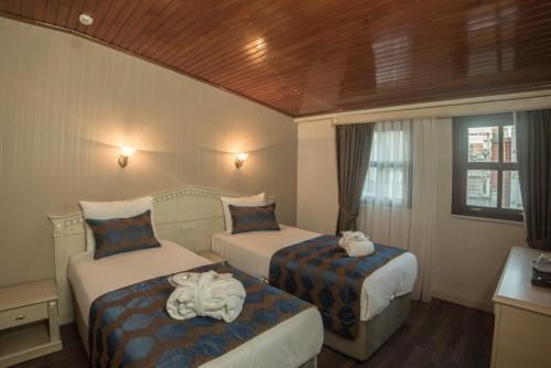 Posteľ alebo postele v izbe v ubytovaní Sarnic Hotel Ottoman Mansion