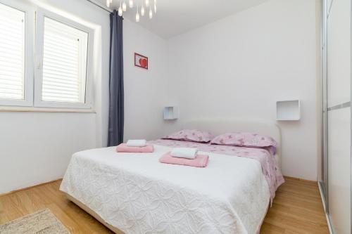 Postel nebo postele na pokoji v ubytování Apartman Duje