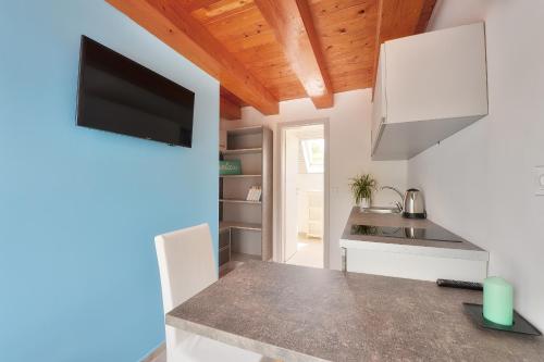 a kitchen with a sink and a counter top at Villa Oliver 3 Siófok in Siófok