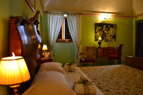 Postel nebo postele na pokoji v ubytování B&B Palazzo La Loggia