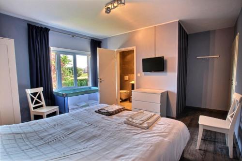 Postel nebo postele na pokoji v ubytování My Lodge Arimont