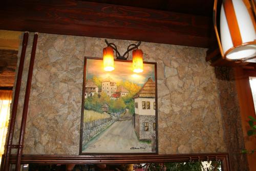a picture of a painting on a wall at Motel Orhideja in Donji Vakuf