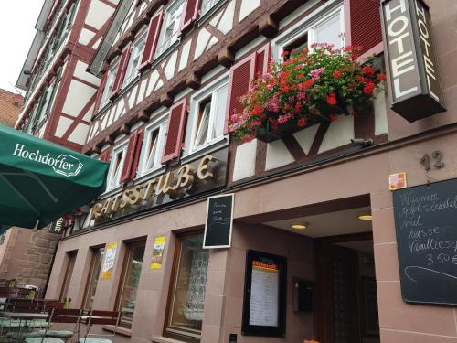 a building with flower boxes on the side of it at Hotel-Restaurant Ratsstube in Calw