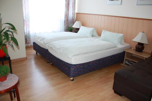 Кровать или кровати в номере Hotel Römerhafen