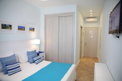 מיטה או מיטות בחדר ב-Terra d'Acqua Resort & SPA