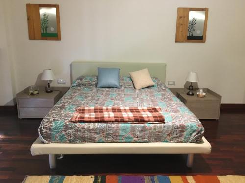 Postel nebo postele na pokoji v ubytování Gioviale Rooms