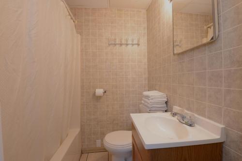 a bathroom with a sink and a toilet at Sea Garden Motel in Seaside Heights