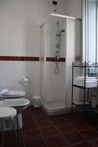 a bathroom with a shower and a toilet and a sink at Cà Veja in Montà