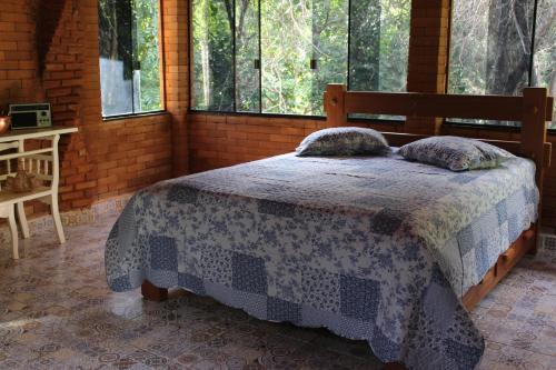 Ένα ή περισσότερα κρεβάτια σε δωμάτιο στο Sítio Primavera