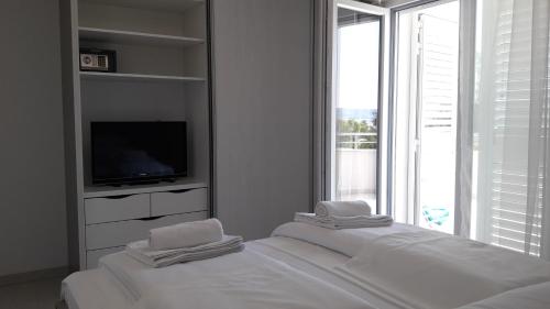 Posteľ alebo postele v izbe v ubytovaní Villa-Apartments Karmel
