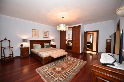 Cama ou camas em um quarto em Villa Santana