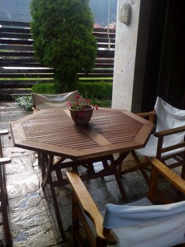 a wooden table with a bowl on top of it at The Stone Villa in Beli Iskar