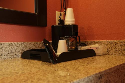 a kitchen counter with a laptop on a counter top at Budget Inn - Washington in Washington
