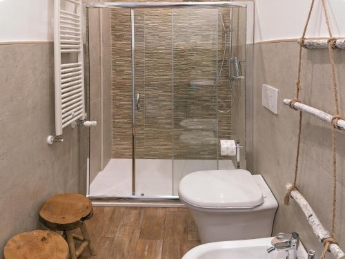 a bathroom with a shower and a toilet and a sink at Le Caruse in Lecce