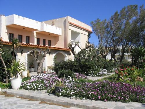 a house with flowers in front of it at Irene Villa in Ierápetra