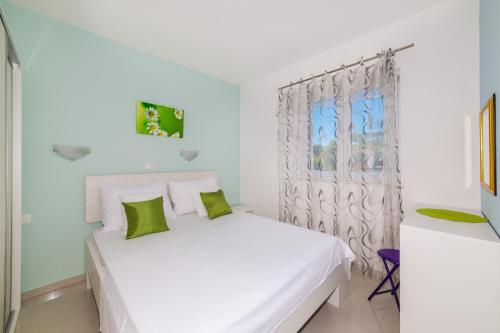 Postel nebo postele na pokoji v ubytování Apartments Iris