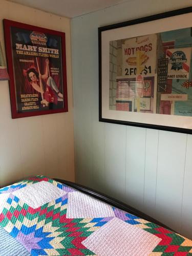 a bedroom with two posters and a quilt on a bed at Klutina Kate's B&B in Copper Center