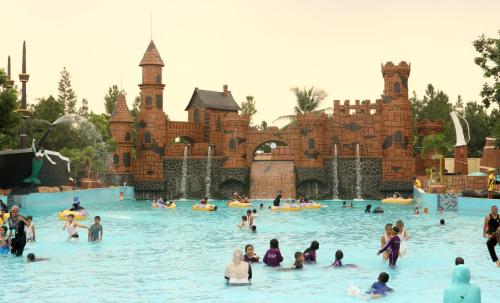 a group of people in the water at a water park at Amaris Hotel Serpong Tangerang in Serpong