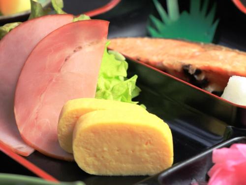 a close up of a sandwich and a sandwich cut in half at Oze Shinkousou in Katashina