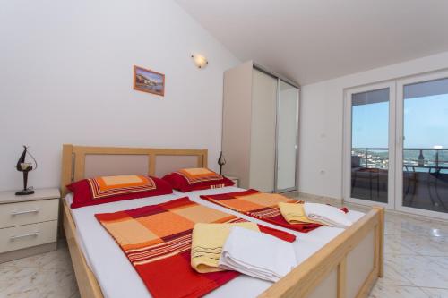 Posteľ alebo postele v izbe v ubytovaní Apartments Jaman Ivan