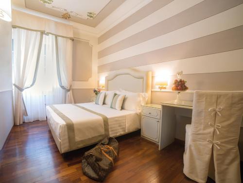 Un ou plusieurs lits dans un hébergement de l'établissement Hotel Jolanda