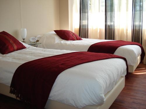 Een bed of bedden in een kamer bij Bed and Breakfast Oosterpark