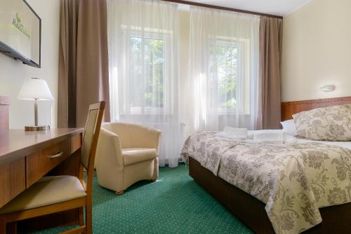 Łóżko lub łóżka w pokoju w obiekcie Hotel Zielony
