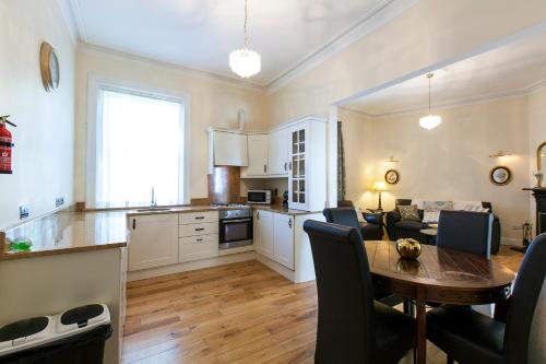 a kitchen and living room with a table and chairs at Dublin Vacation Rentals in Dublin