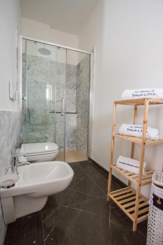 a bathroom with a shower and a toilet and a sink at Le Stanze Di Brando E Nico in Tricase