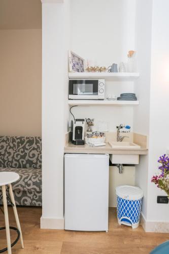 a small kitchen with a counter and a sink at Le Stanze Di Brando E Nico in Tricase