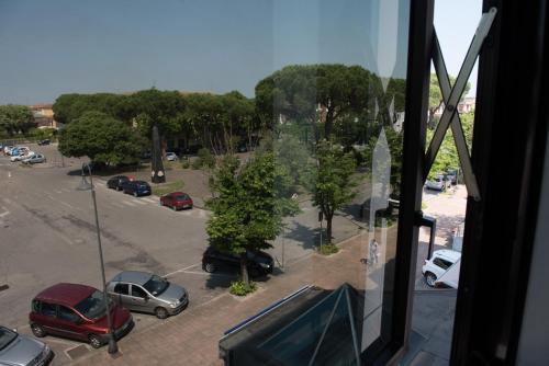 a view from a window of a parking lot at Hotel Tessarin in Taglio di Po