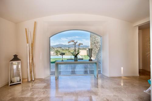a dining room with a table and a window at Es Lligats Agroturismo - Adults Only in Sant Llorenç des Cardassar