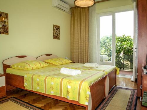 Ένα ή περισσότερα κρεβάτια σε δωμάτιο στο Rooms Carpe Diem