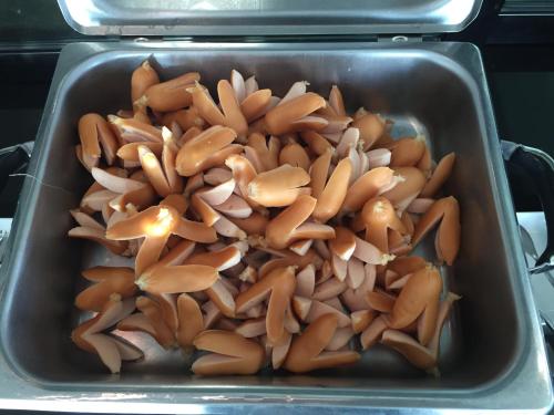 a metal pan filled with brown mushrooms in an oven at Baancivilize Resort in Khanom
